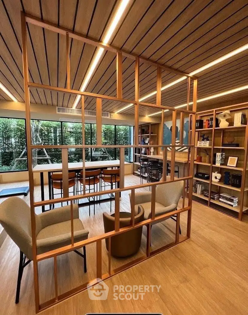 Modern library with stylish wooden decor and ample natural light