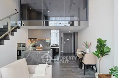 Modern duplex apartment with sleek kitchen and stylish living area