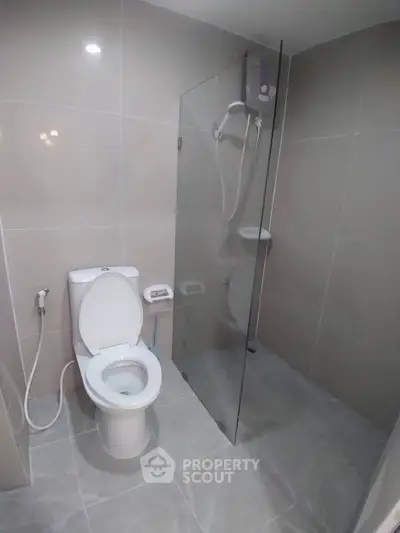 Modern bathroom with glass shower and sleek tile design