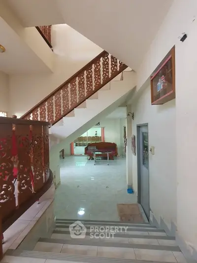 Spacious interior with elegant staircase and open living area