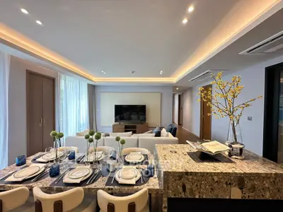 Luxurious open-plan living room with elegant dining area and modern decor