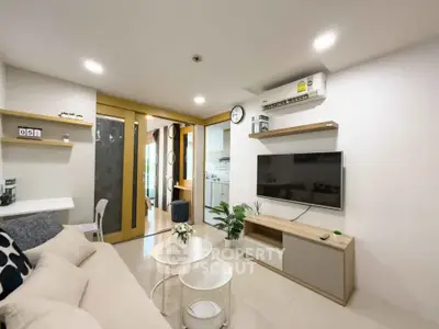 Modern living room with sleek design and open kitchen layout