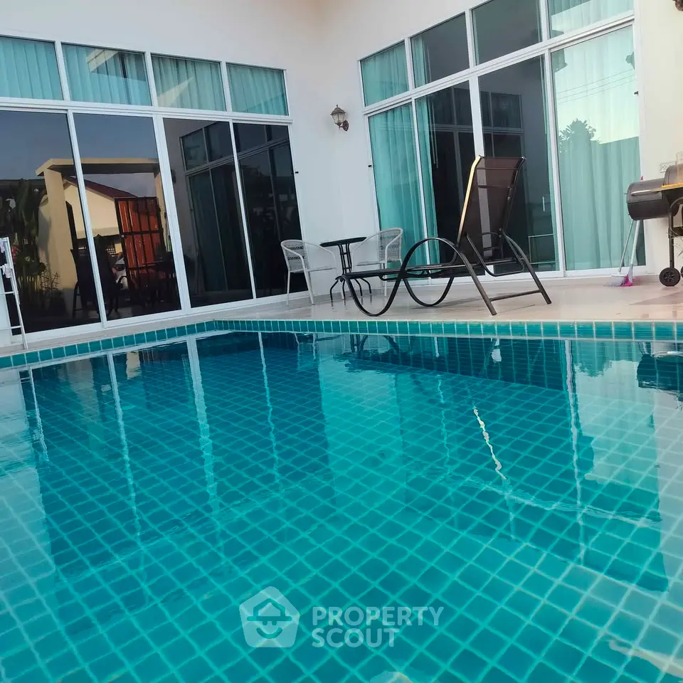 Luxurious private pool with modern patio in a stunning residential property, perfect for relaxation and entertainment.