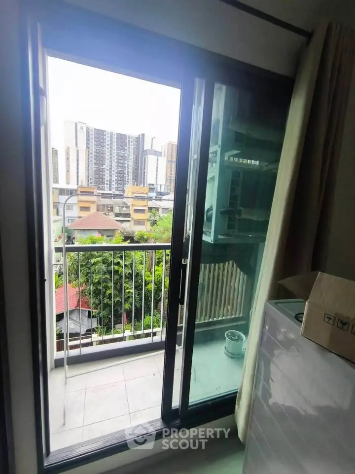 Charming urban balcony with city view, perfect for relaxation and enjoying the skyline.