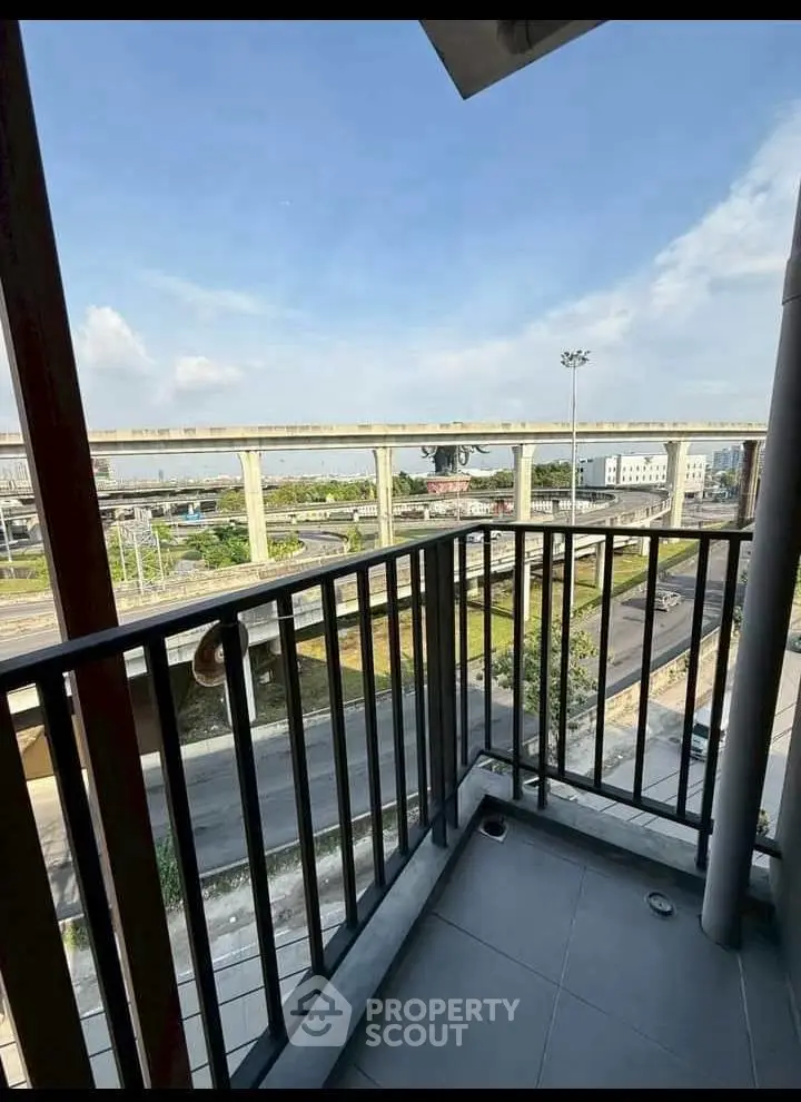 Charming balcony with urban view, perfect for city living enthusiasts seeking a cozy outdoor space.