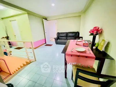 Charming living room with cozy dining area and modern decor, perfect for relaxation and entertaining.