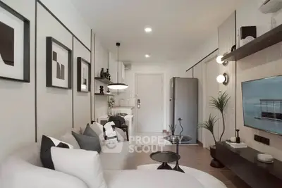 Modern living room with sleek design, featuring cozy seating, stylish decor, and a compact kitchen area.