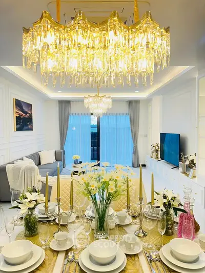 Luxurious living room with elegant chandelier and stylish decor