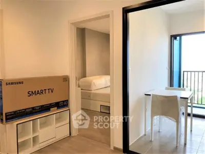 Modern apartment interior with smart TV box, cozy bedroom, and balcony view.