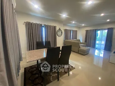 Spacious living room with elegant dining area and modern furnishings