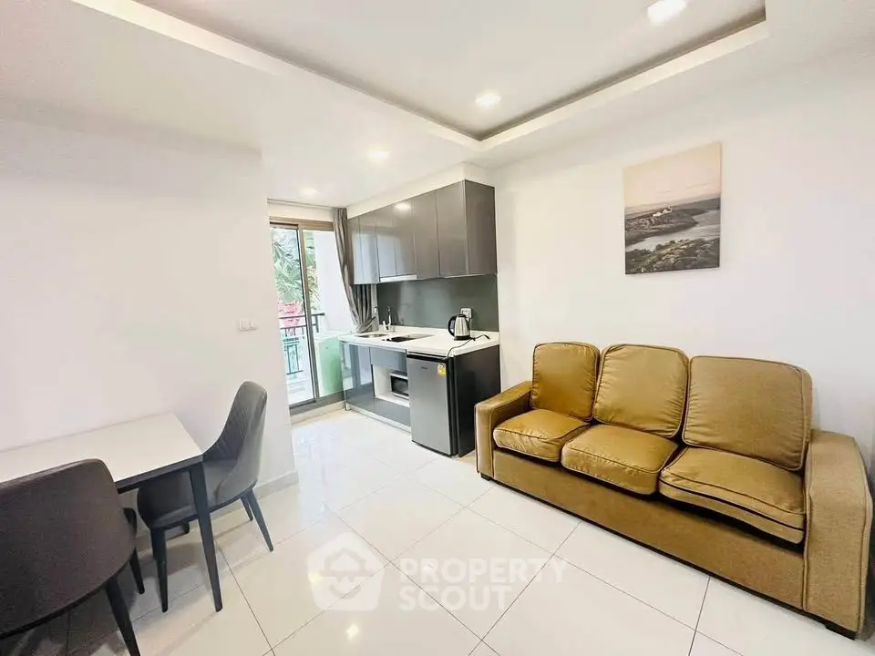 Modern living room with open kitchen and cozy seating area