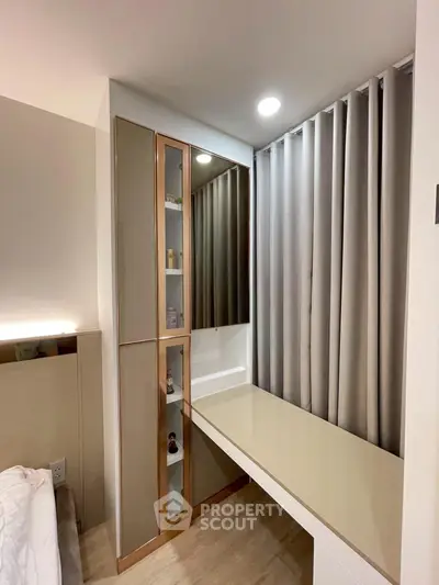 Modern bedroom with sleek built-in storage and elegant curtains