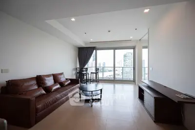 Spacious living room with stunning city view and modern furnishings