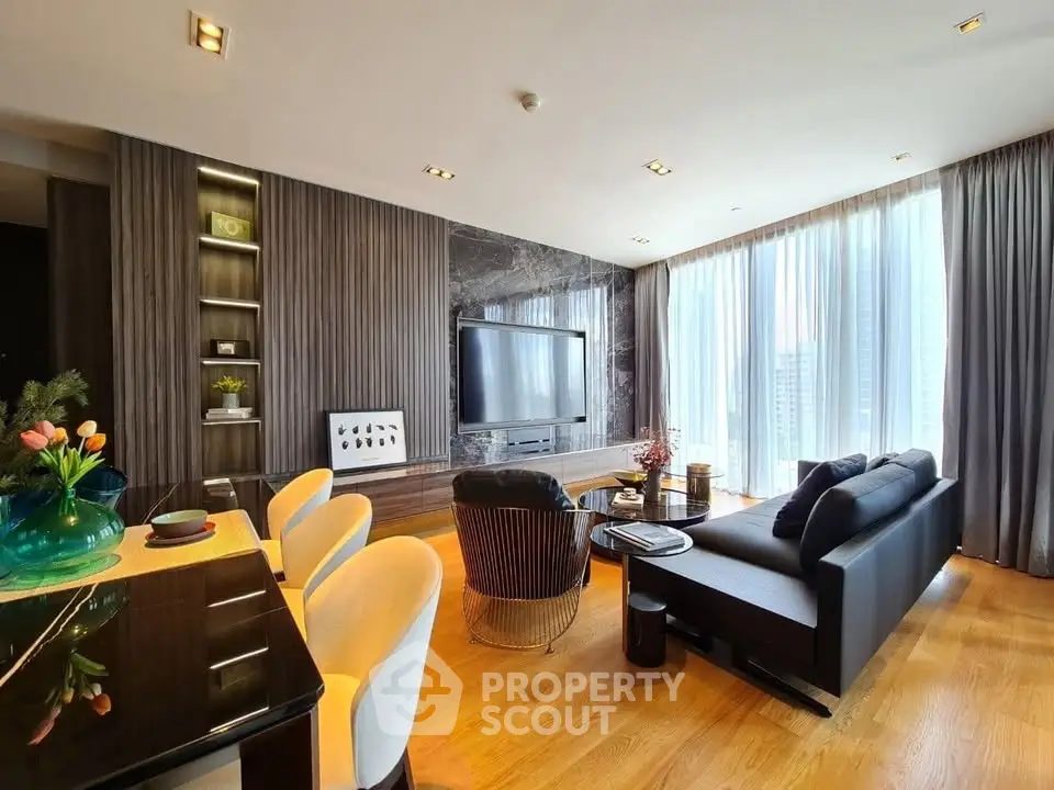 Luxurious modern living room with elegant decor and large windows offering city views.