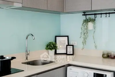 Modern kitchen with sleek design and washing machine