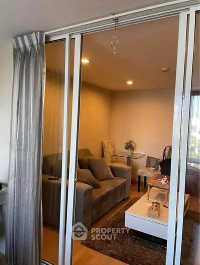 Cozy living room with sliding glass doors and modern furnishings