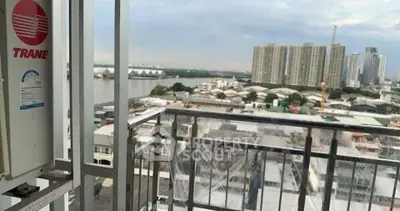 Stunning cityscape view from a high-rise balcony overlooking the river and skyline.