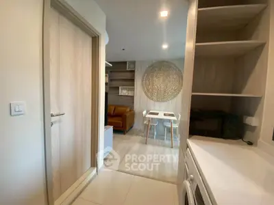 Modern apartment interior with open layout, featuring a cozy living area and stylish decor.