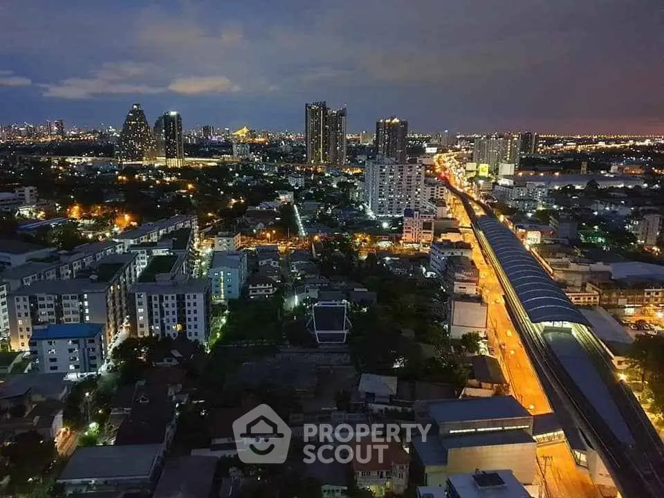 Stunning cityscape view showcasing vibrant urban skyline at dusk with illuminated streets and modern high-rise buildings.