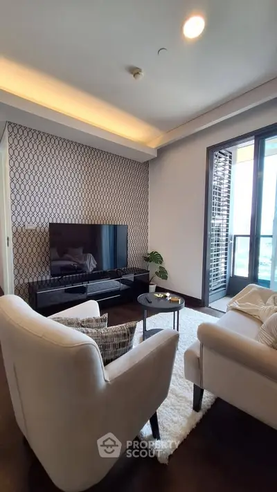 Elegant living room with modern decor and large window offering natural light and city views.