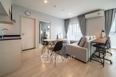 Modern living room with open kitchen and stylish furniture