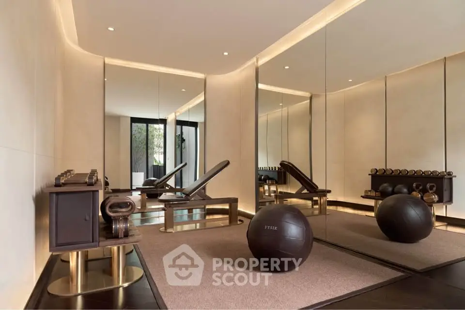 Luxurious home gym with modern equipment and mirrored walls
