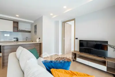 Modern living room with open kitchen and stylish decor