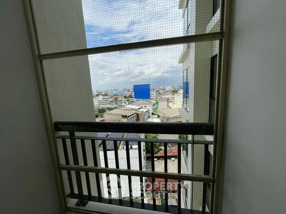 Stunning cityscape view from a high-rise balcony, showcasing urban living with expansive skyline.