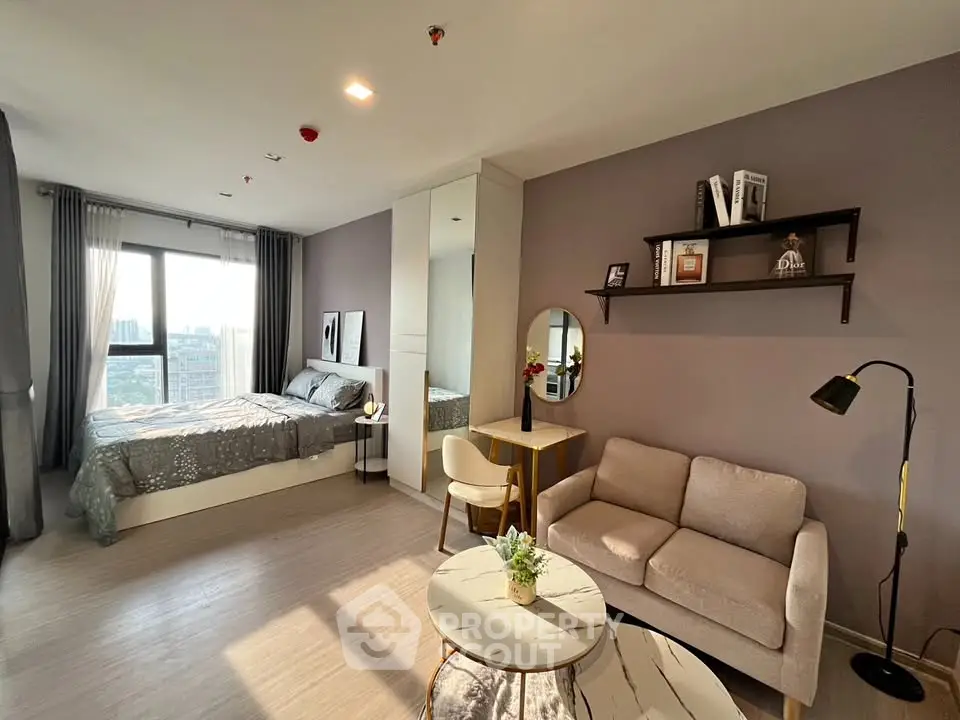 Modern studio apartment with cozy living area and stylish decor