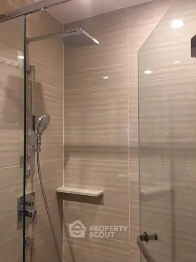 Modern bathroom with sleek glass shower and elegant tile design