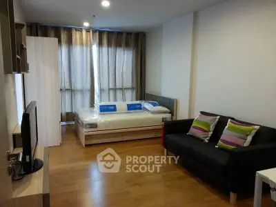 Modern studio apartment with cozy living area and stylish decor