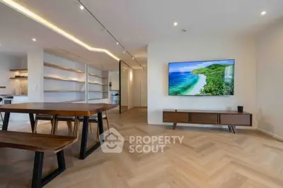 Modern living room with stylish wooden furniture and large wall-mounted TV