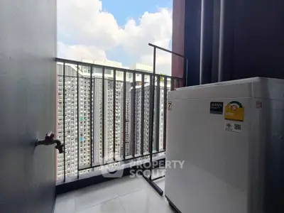 High-rise apartment balcony with city view and washing machine