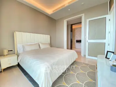 Luxurious bedroom with elegant decor and modern lighting in a high-end apartment.