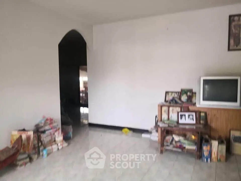 Cozy living room with vintage TV and decor, perfect for family gatherings.