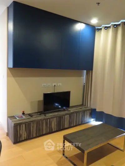 Modern living room with sleek TV unit and stylish cabinetry