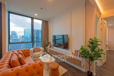 Luxurious living room with stunning city view, featuring elegant furniture and modern decor.