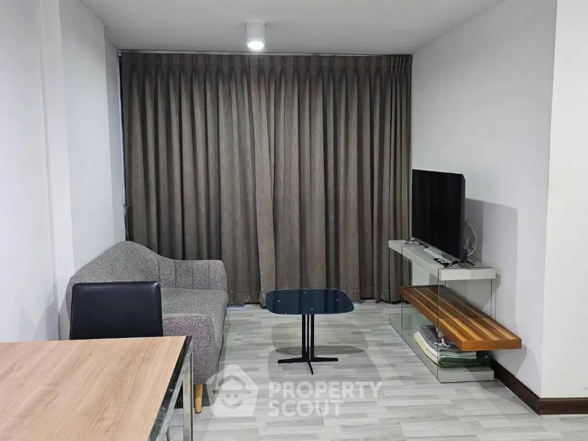 Cozy living room with modern furniture and TV setup