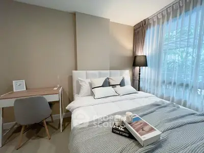 Modern bedroom with stylish decor and natural light