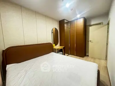 Modern bedroom with stylish furniture and ample storage space
