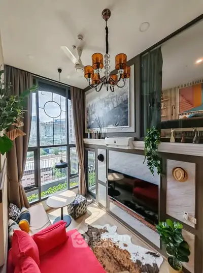 Stylish modern living room with high ceilings and large windows offering city views.