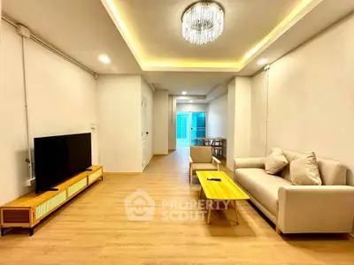 Spacious modern living room with elegant lighting and stylish furniture