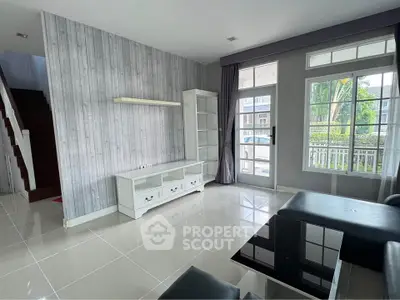 Modern living room with sleek design and large windows for natural light