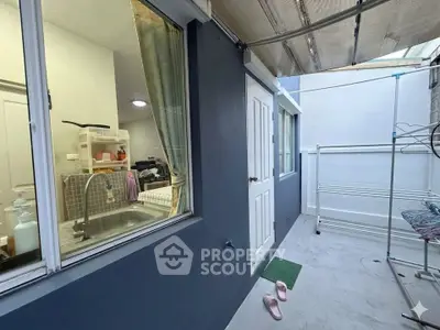 Charming outdoor laundry area with modern design and ample space.