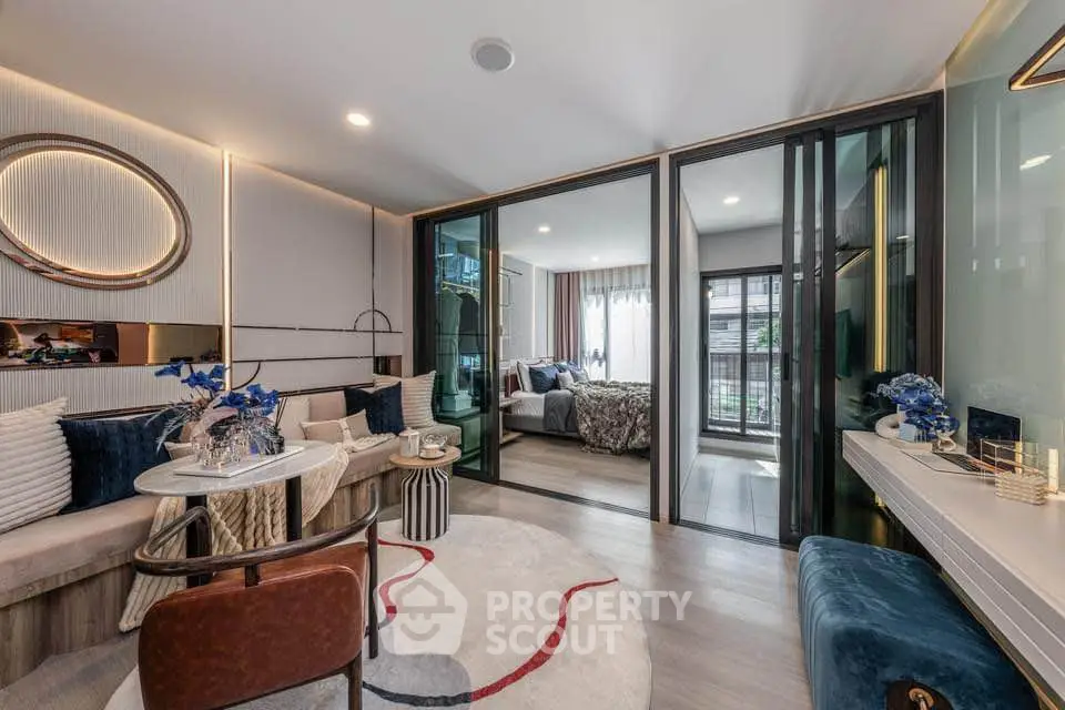 Luxurious modern living room with stylish decor and open view to bedroom