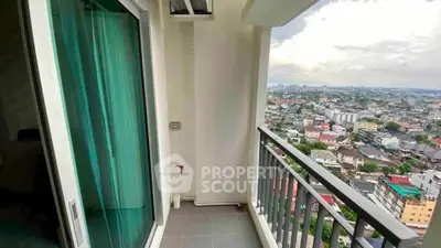 Stunning balcony view overlooking cityscape from modern high-rise apartment.