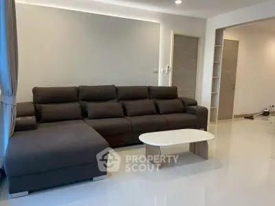 Modern living room with sleek sectional sofa and minimalist decor