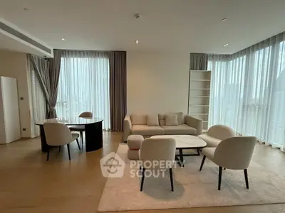 Spacious modern living room with elegant furniture and large windows