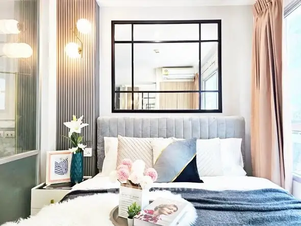 Luxurious bedroom with elegant decor and plush bedding in modern apartment