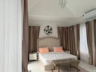 Luxurious bedroom with elegant decor and natural light
